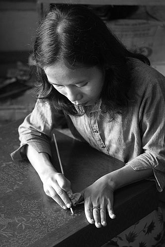 Carving the lacquer.