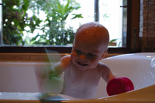 Gus gets busy during bathtime.