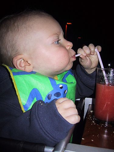 Gus drinks some papaya juice.