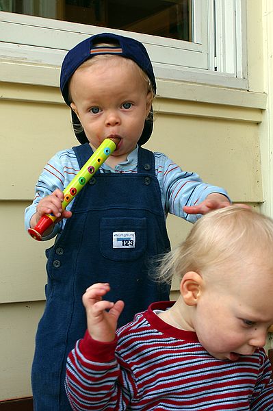 Blowing his horn and pounding on his bro,